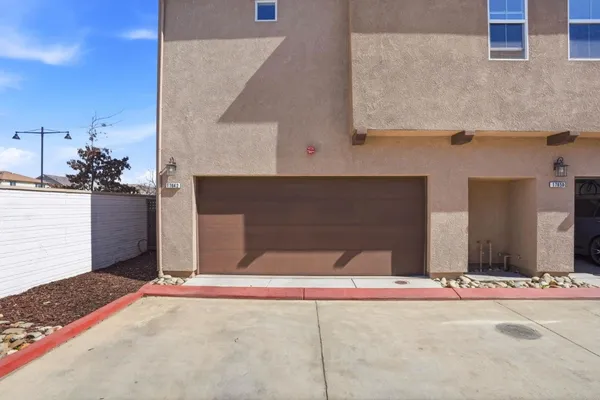 a front view of a house with garage