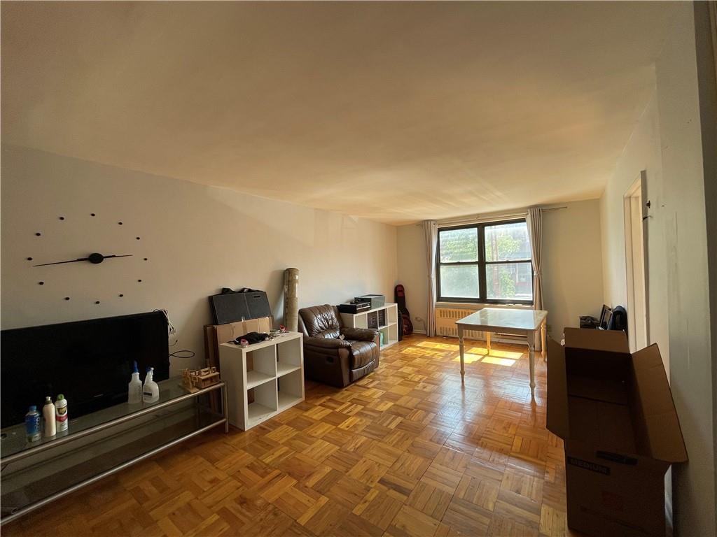 877 Bay Ridge Avenue, Unit 1A Brooklyn, NY 11220 - Photo 2 of 6 a living room with furniture flat screen tv and fireplace