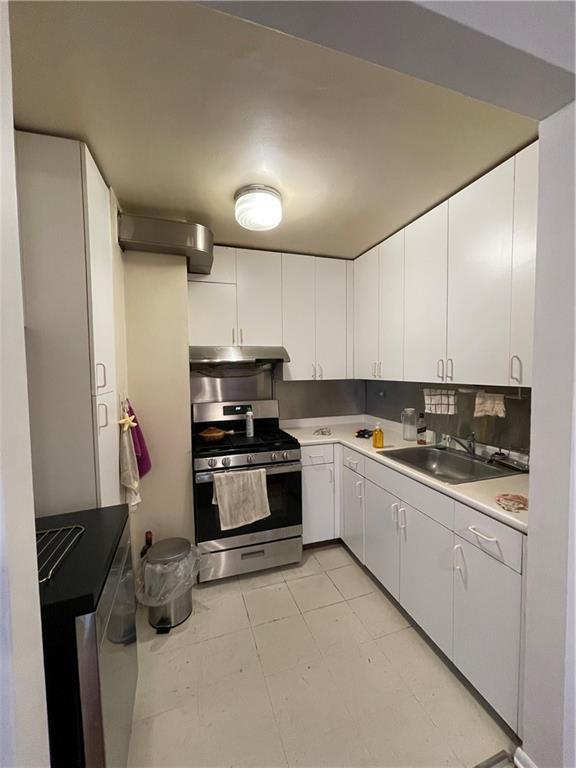 877 Bay Ridge Avenue, Unit 1A Brooklyn, NY 11220 - Photo 3 of 6 a kitchen with stainless steel appliances a stove and a refrigerator