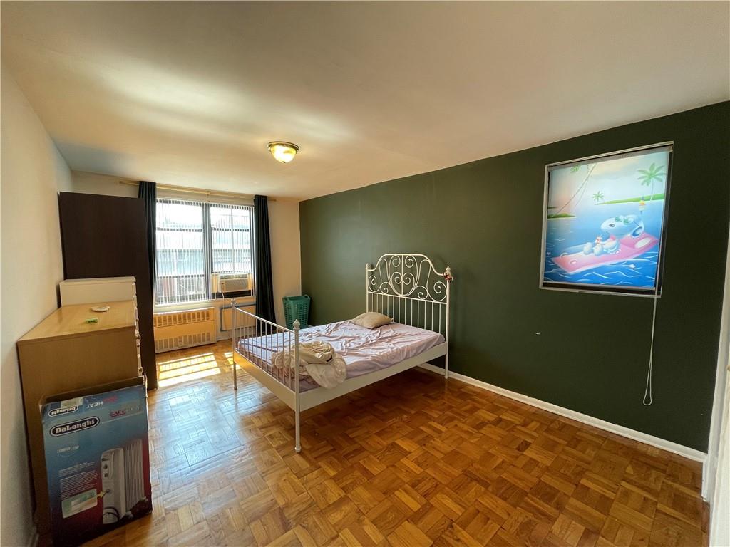 877 Bay Ridge Avenue, Unit 1A Brooklyn, NY 11220 - Photo 4 of 6 a living room with furniture and a flat screen tv