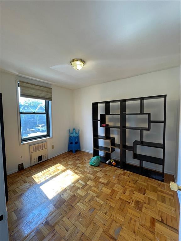 877 Bay Ridge Avenue, Unit 1A Brooklyn, NY 11220 - Photo 5 of 6 a view of a room with furniture window and wooden floor