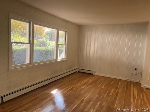 13 Hollow Tree Ridge Road Darien, CT 06820 - Photo 2 of 12 a view of an empty room with wooden floor and a window