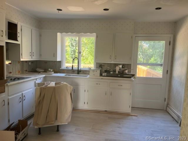 13 Hollow Tree Ridge Road Darien, CT 06820 - Photo 4 of 12 a kitchen with a white cabinets and window
