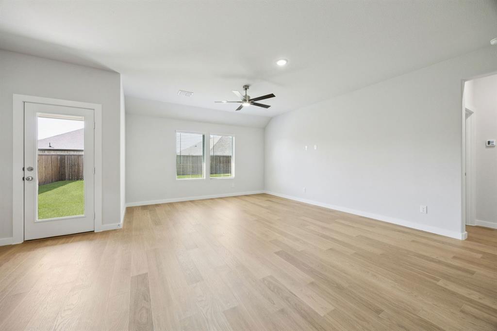 6628 Dusty Rdg Road Fort Worth, TX 76123 - Photo 8 of 27 Living Room in the Heisman home plan by Trophy Signature Homes – REPRESENTATIVE PHOTO