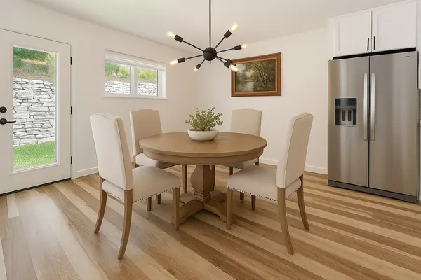 a kitchen with stainless steel appliances granite countertop a sink a stove and a refrigerator
