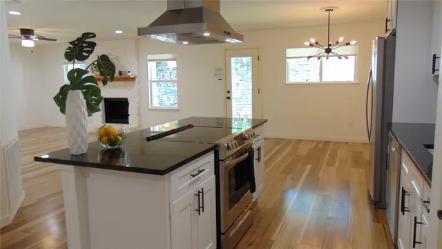 a kitchen with sink and refrigerator