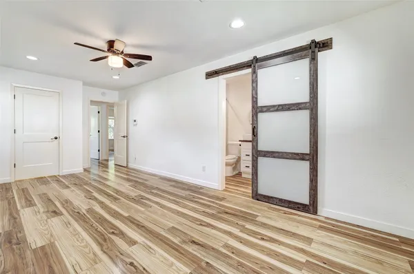 a living room with furniture and a mirror