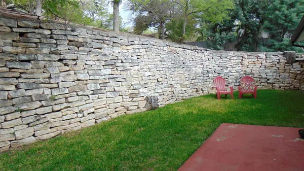 a view of a park with bench and trees