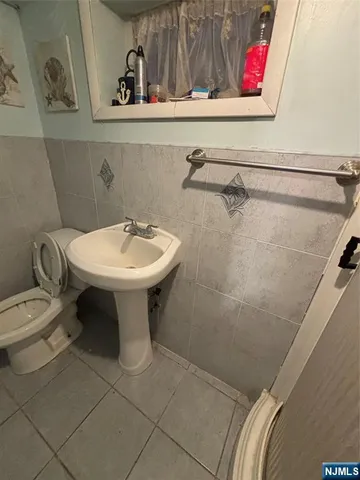 a bathroom with a toilet and a sink