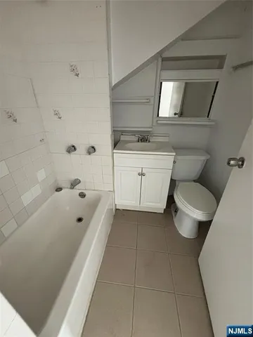 a bathroom with a toilet sink and bathtub