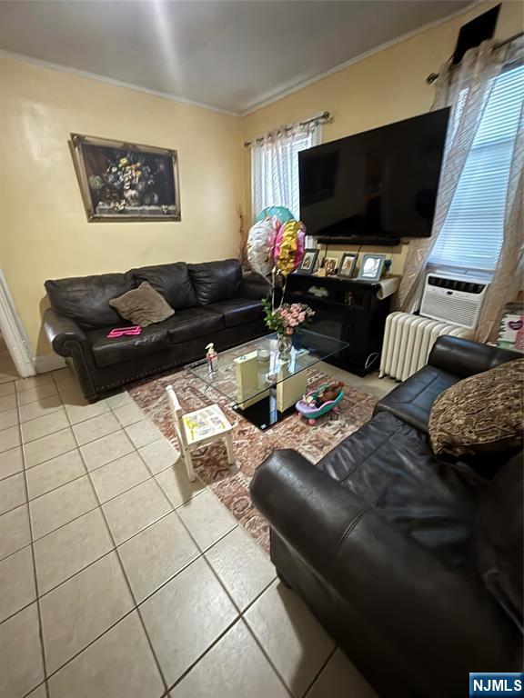 552 River Street Paterson, NJ 07524 - Photo 5 of 21 a living room with furniture and a flat screen tv