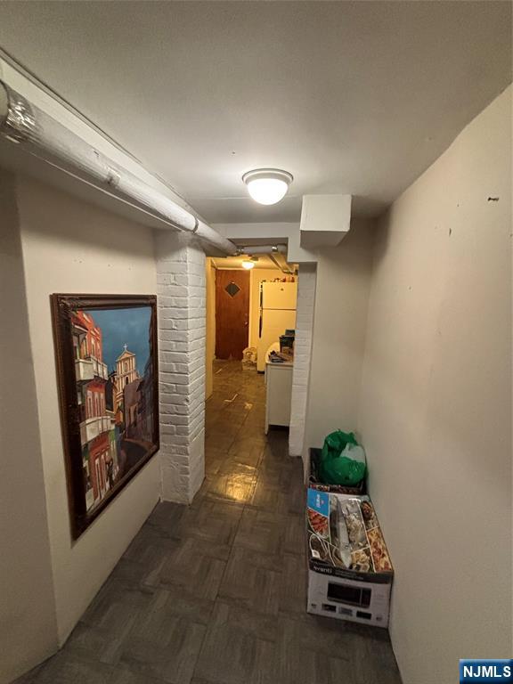 552 River Street Paterson, NJ 07524 - Photo 8 of 21 a hallway with toys and wooden floor