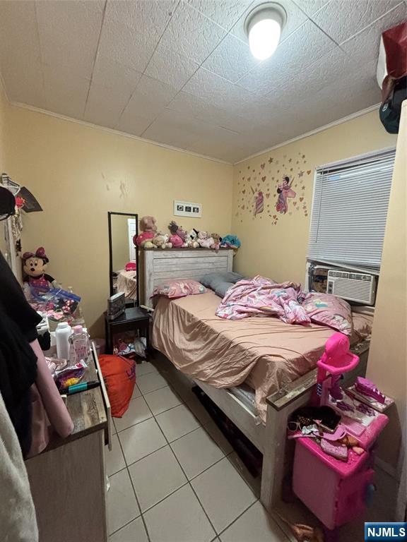 552 River Street Paterson, NJ 07524 - Photo 10 of 21 a bedroom with a bed and a desk