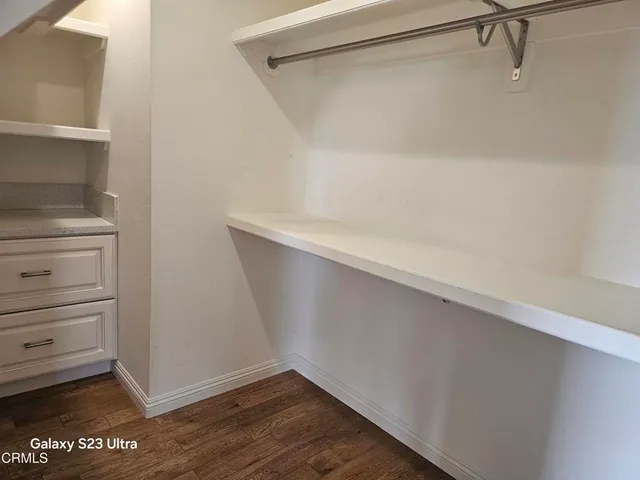 a view of an empty walk in closet