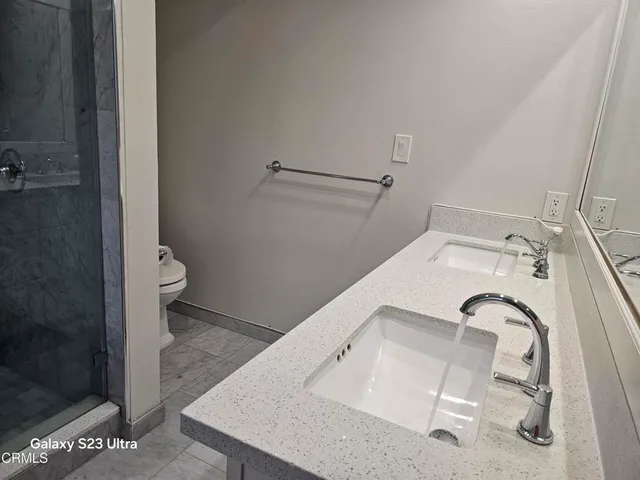 a bathroom with a sink and toilet