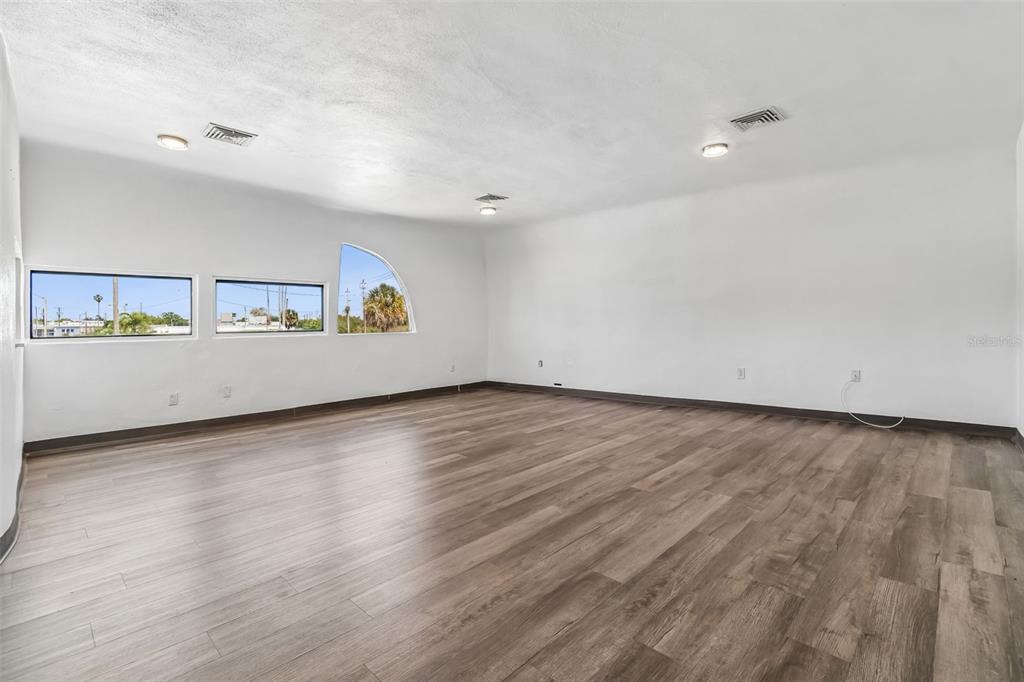 100 East Shell Point Road Ruskin, FL 33570 - Photo 19 of 41 an empty room with wooden floor and windows