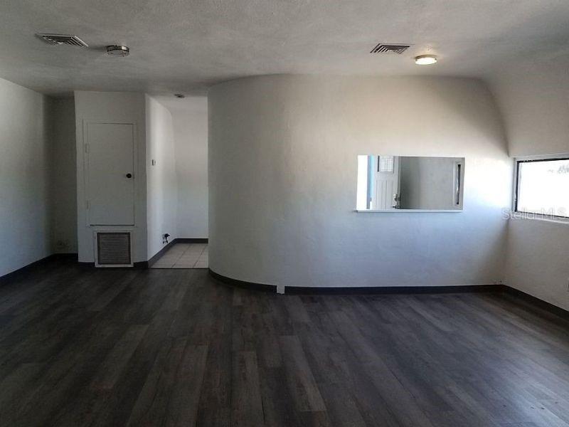 100 East Shell Point Road Ruskin, FL 33570 - Photo 23 of 41 an empty room with wooden floor and windows