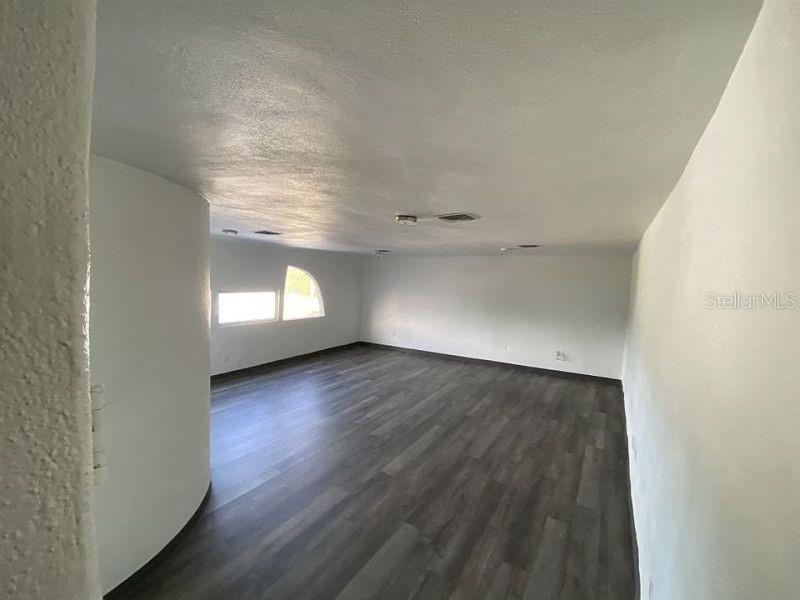 100 East Shell Point Road Ruskin, FL 33570 - Photo 24 of 41 an empty room with wooden floor and windows