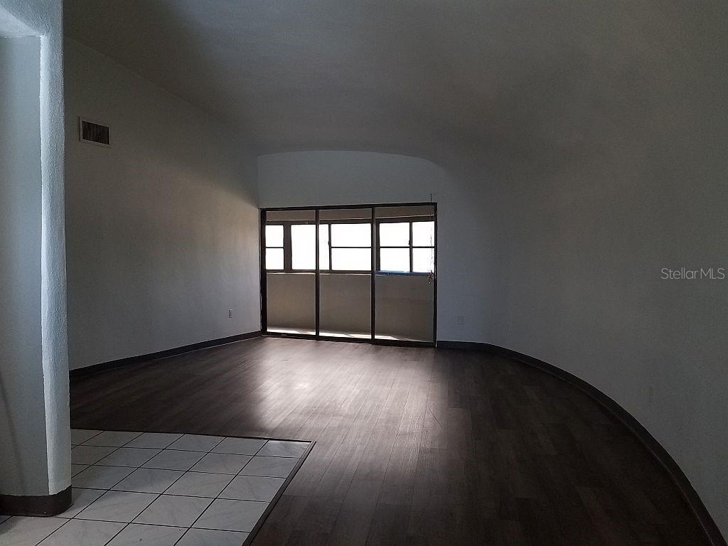 100 East Shell Point Road Ruskin, FL 33570 - Photo 27 of 41 an empty room with wooden floor and windows
