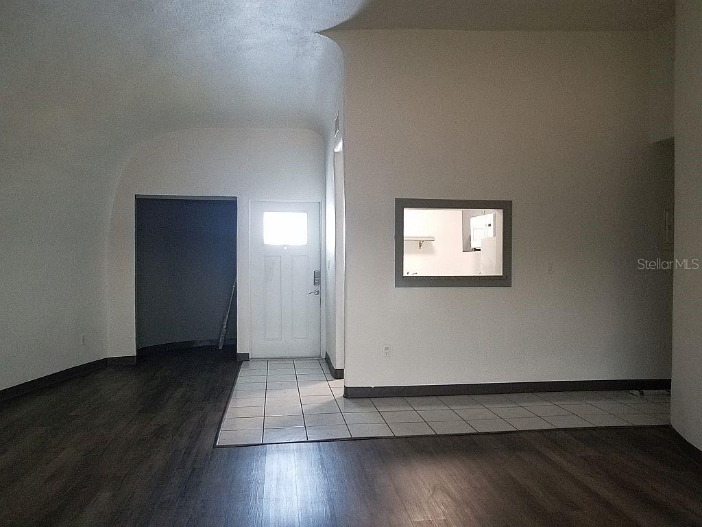 100 East Shell Point Road Ruskin, FL 33570 - Photo 28 of 41 an empty room with wooden floor and windows