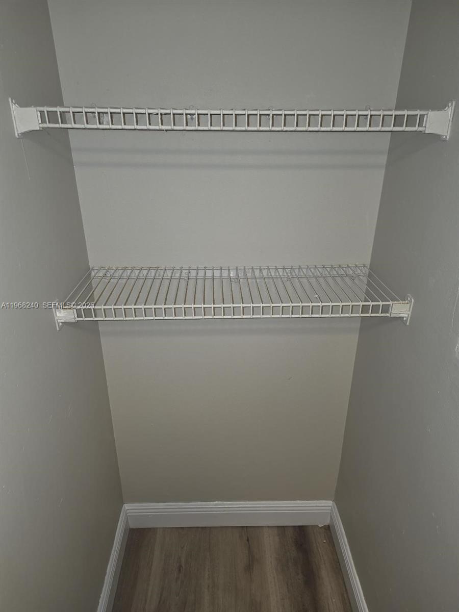 3399 Foxcroft Road, Unit 203 Miramar, FL 33025 - Photo 13 of 15 a close view of utility room with racks on the wall