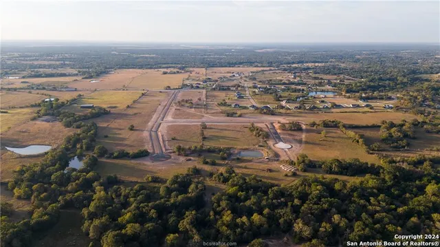 an aerial view of residential building and ocean