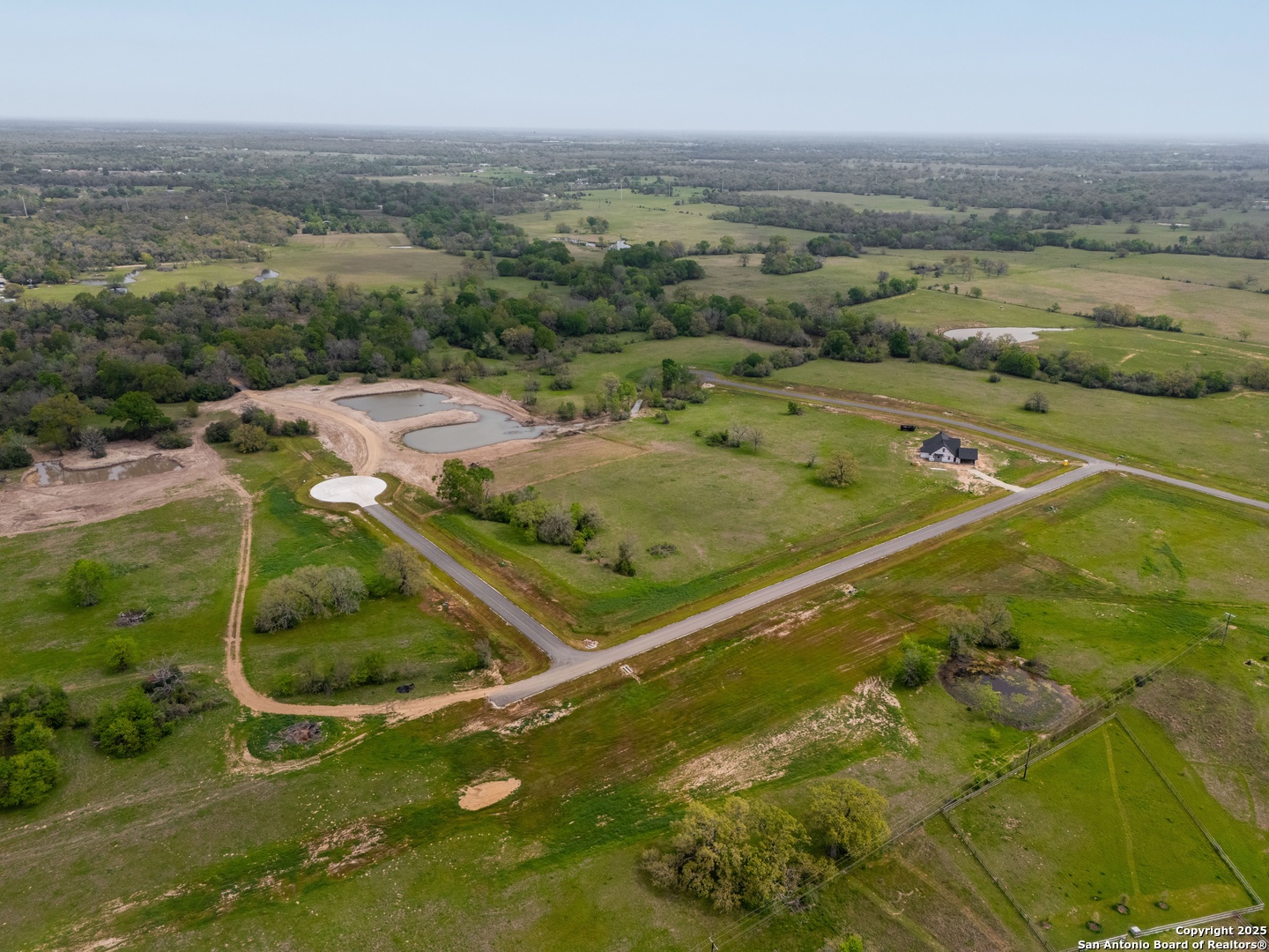 Lot 36 Panther Ridge Drive Iola, TX 77861 - Photo 3 of 48 an aerial view of residential houses with outdoor space and swimming pool