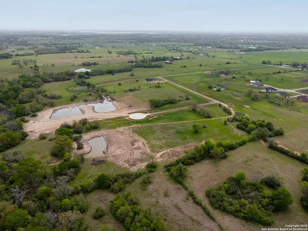 an aerial view of a houses with outdoor space