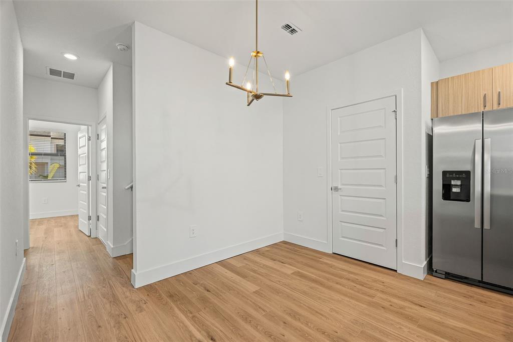 8025 Gulfstream Court Lakewood Ranch, FL 34202 - Photo 15 of 44 a view of empty room with wooden floor