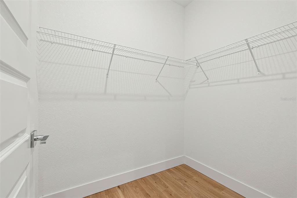 8025 Gulfstream Court Lakewood Ranch, FL 34202 - Photo 26 of 44 a view of a room with racks on the wall