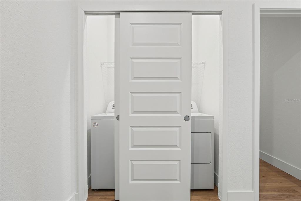 8025 Gulfstream Court Lakewood Ranch, FL 34202 - Photo 29 of 44 a view of walk in closet with empty racks