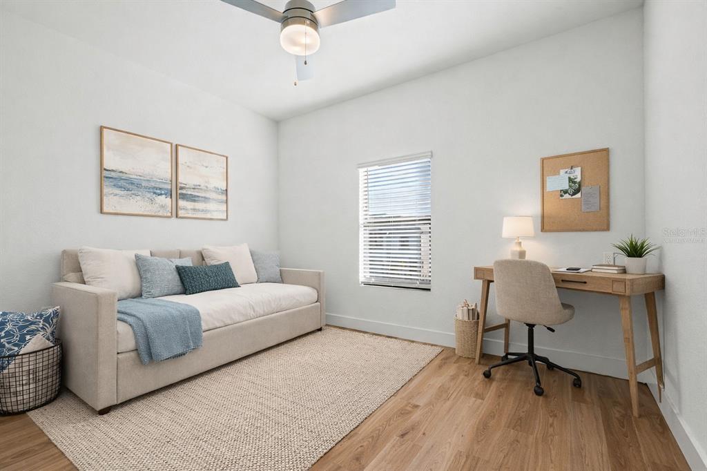 8025 Gulfstream Court Lakewood Ranch, FL 34202 - Photo 34 of 44 a living room with furniture and a window