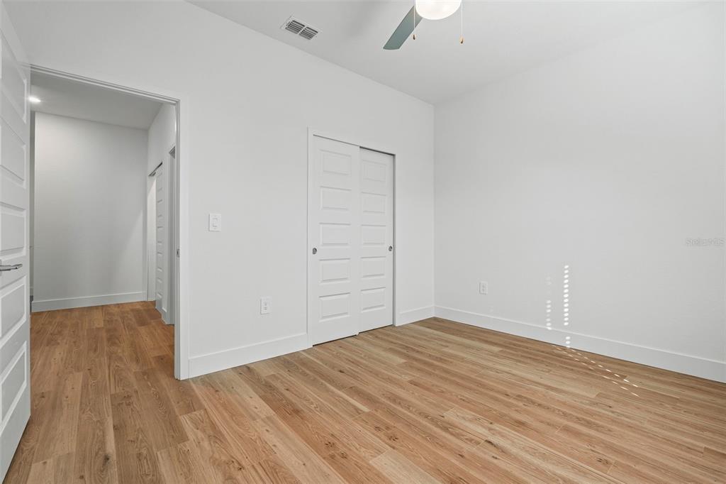 8025 Gulfstream Court Lakewood Ranch, FL 34202 - Photo 36 of 44 wooden floor in an empty room