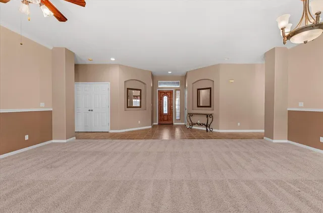 a bathroom with a sink a vanity and a large mirror