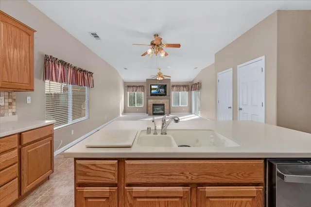 a front view of a house with a garden and yard