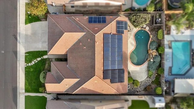 a view of a livingroom with wooden floor and furniture