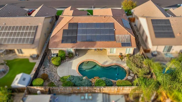 a kitchen with stainless steel appliances granite countertop a stove a sink dishwasher and a refrigerator