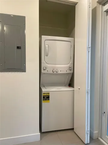 a kitchen with stainless steel appliances and refrigerator