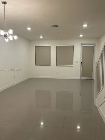 a view of empty room with windows