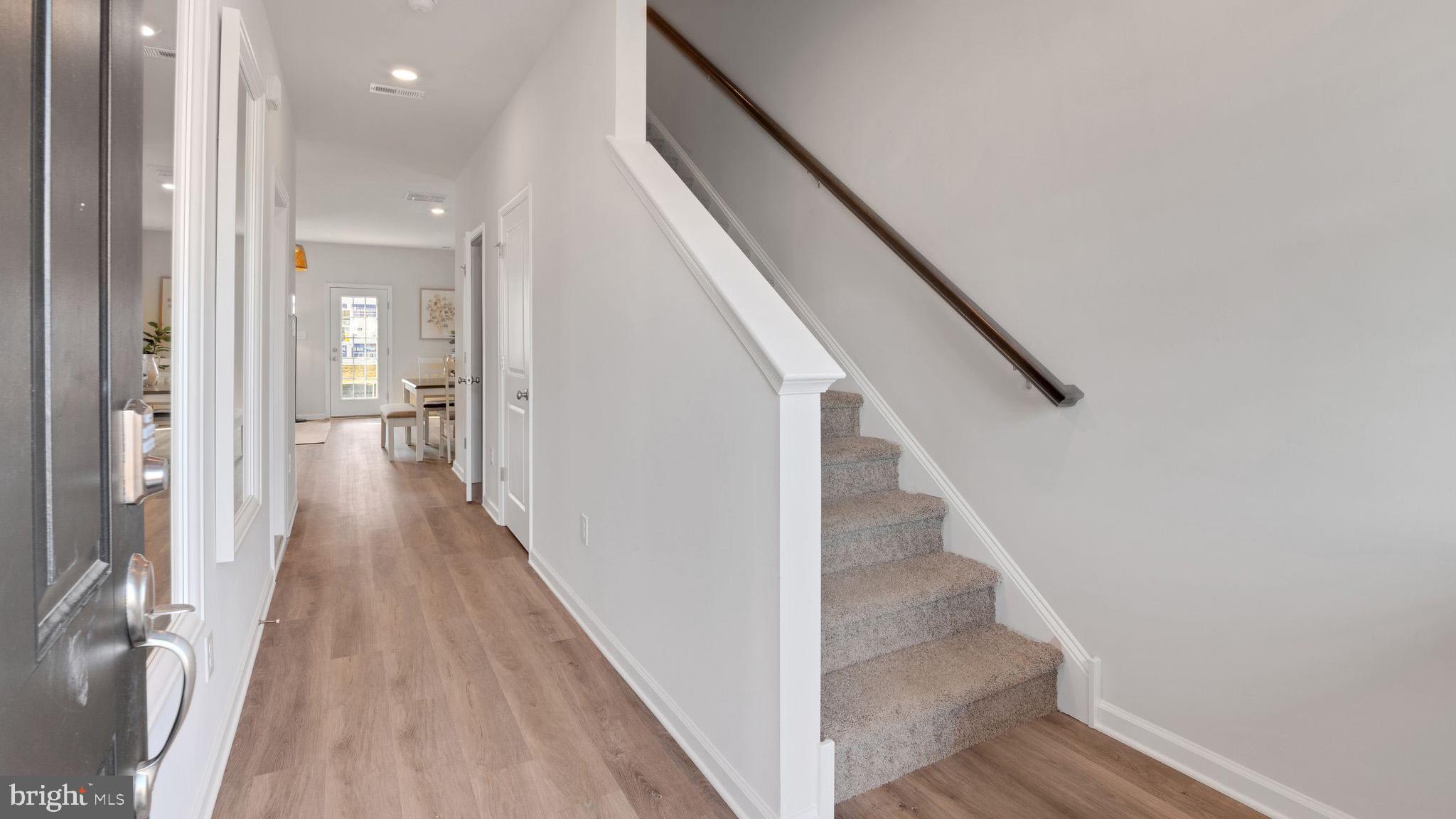 2 Whaler Drive Runnemede, NJ 08078 - Photo 19 of 23 a view of a hallway with wooden floor and staircase