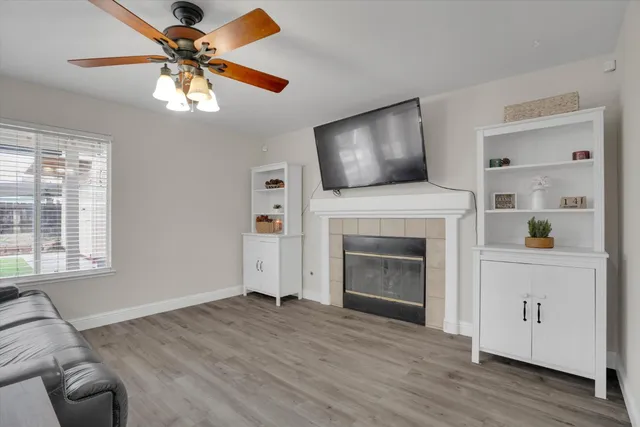 a living room with furniture and a fireplace