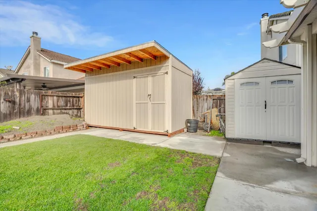 a view of a house with a yard and garage