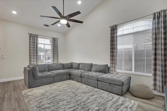 a living room with furniture and a window