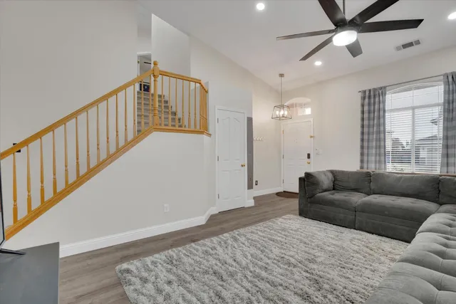 a living room with furniture and a window