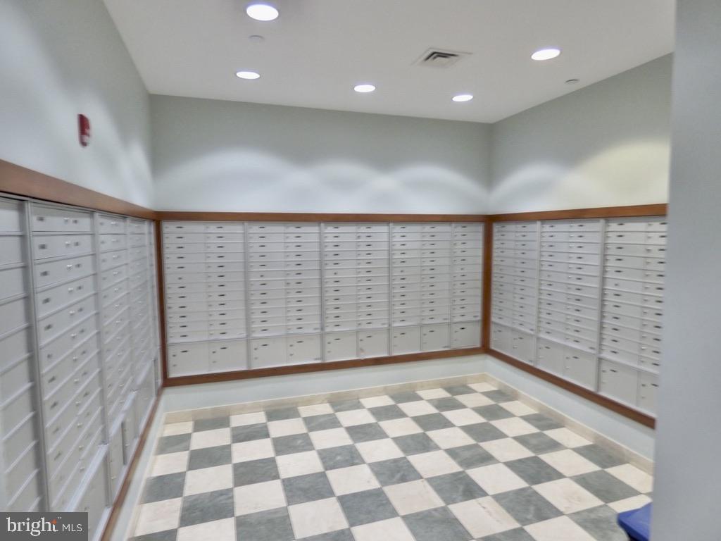 11800 Sunset Hills Road, Unit 118 Reston, VA 20190 - Photo 33 of 52 Modern mailroom with organized boxes.
