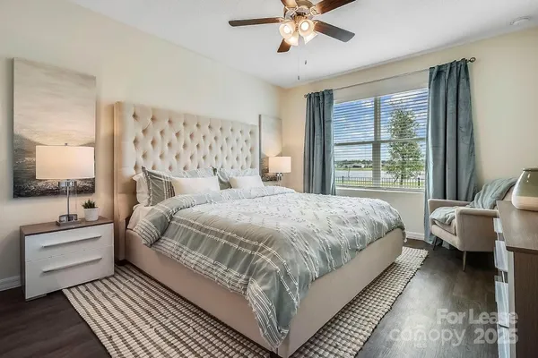 a bedroom with a large bed and a window