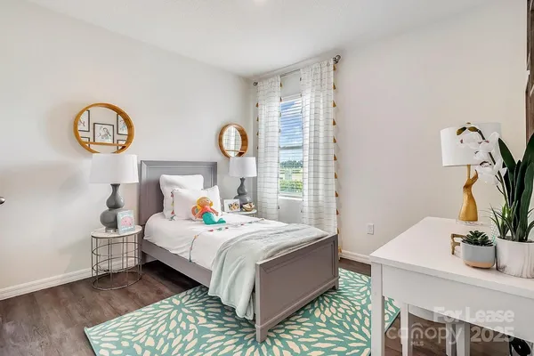 a bedroom with a bed and a table