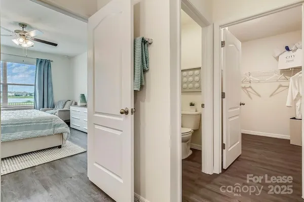 a bedroom with a bed and a view of bathroom
