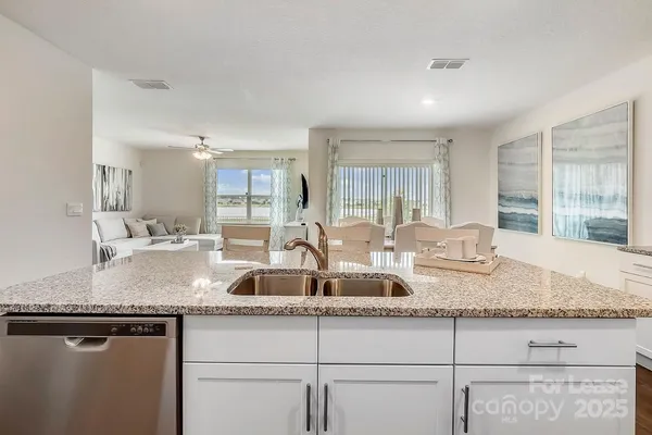 a kitchen with granite countertop a sink and a granite counter tops