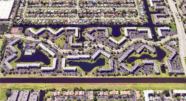 an aerial view of a building with outdoor space